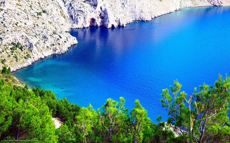 blue bay with rocky cliffs