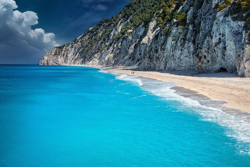 Blue beach with cliffs