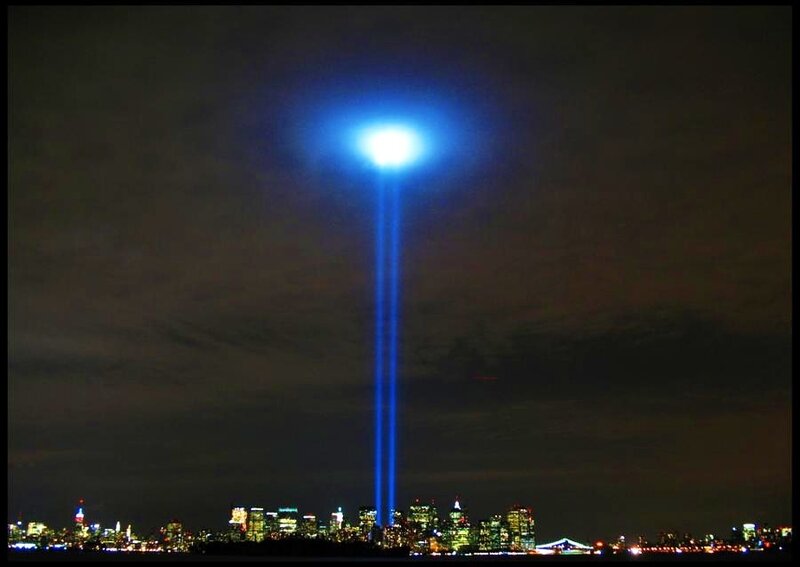 Blue beams over city skyline
