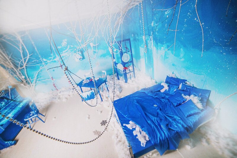 Blue Bed in Snowy Room