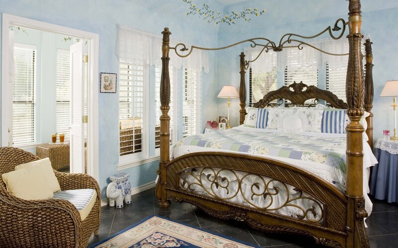 blue bedroom with four-poster bed