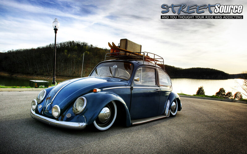 Blue Beetle with surfboard