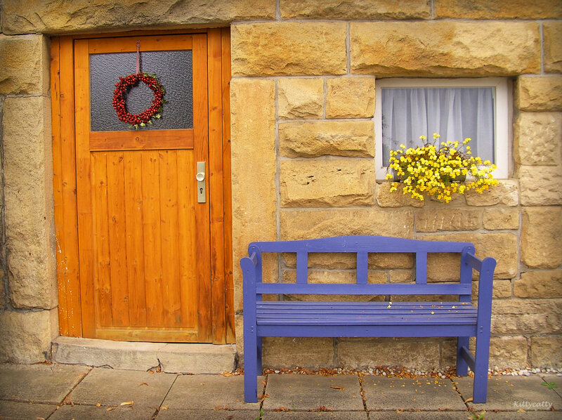 Blue Bench by Door