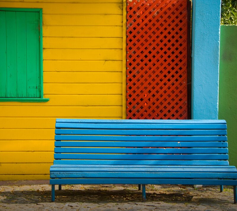 Blue Bench in Front of House