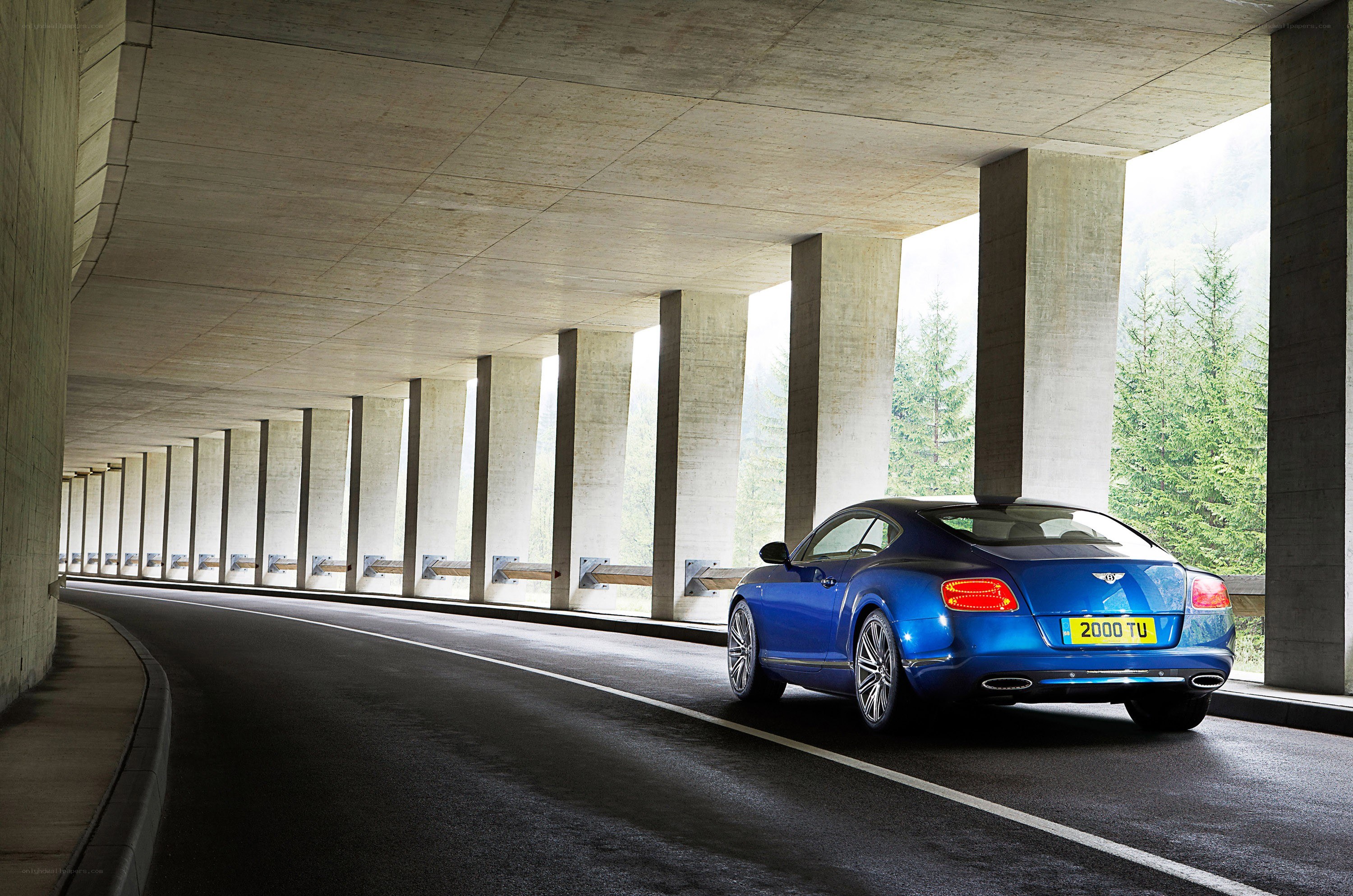 Blue Bentley in a tunnel