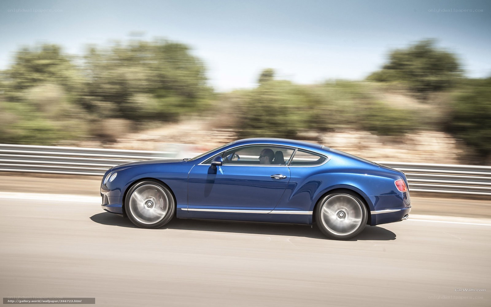 blue bentley in motion