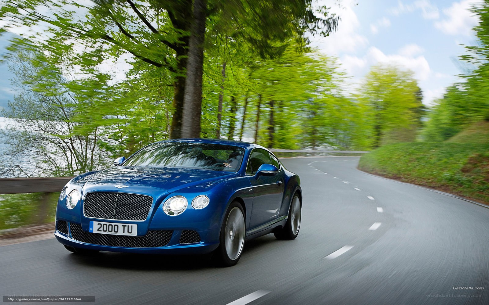 Blue Bentley on a winding road