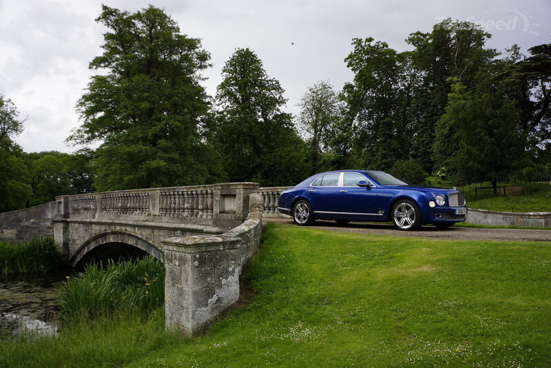 Blue Bentley on Grass