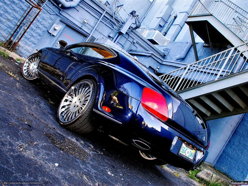 Blue Bentley parked in alley