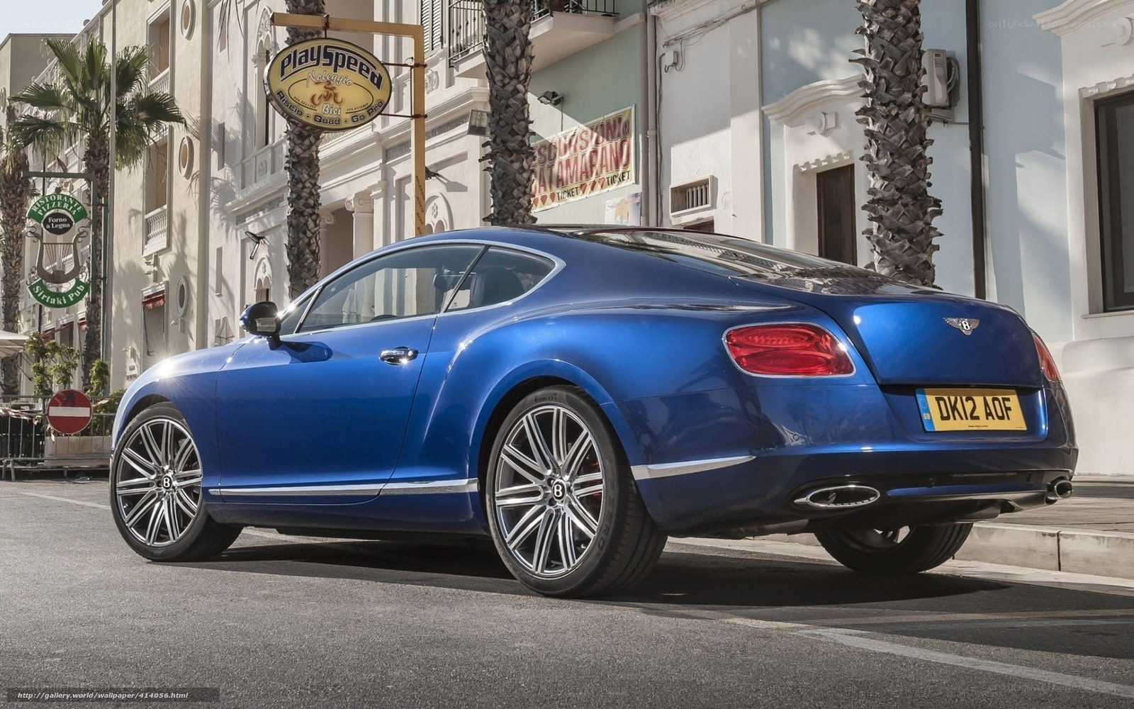 Blue Bentley parked on street