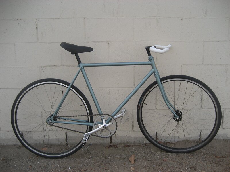 blue bicycle against wall