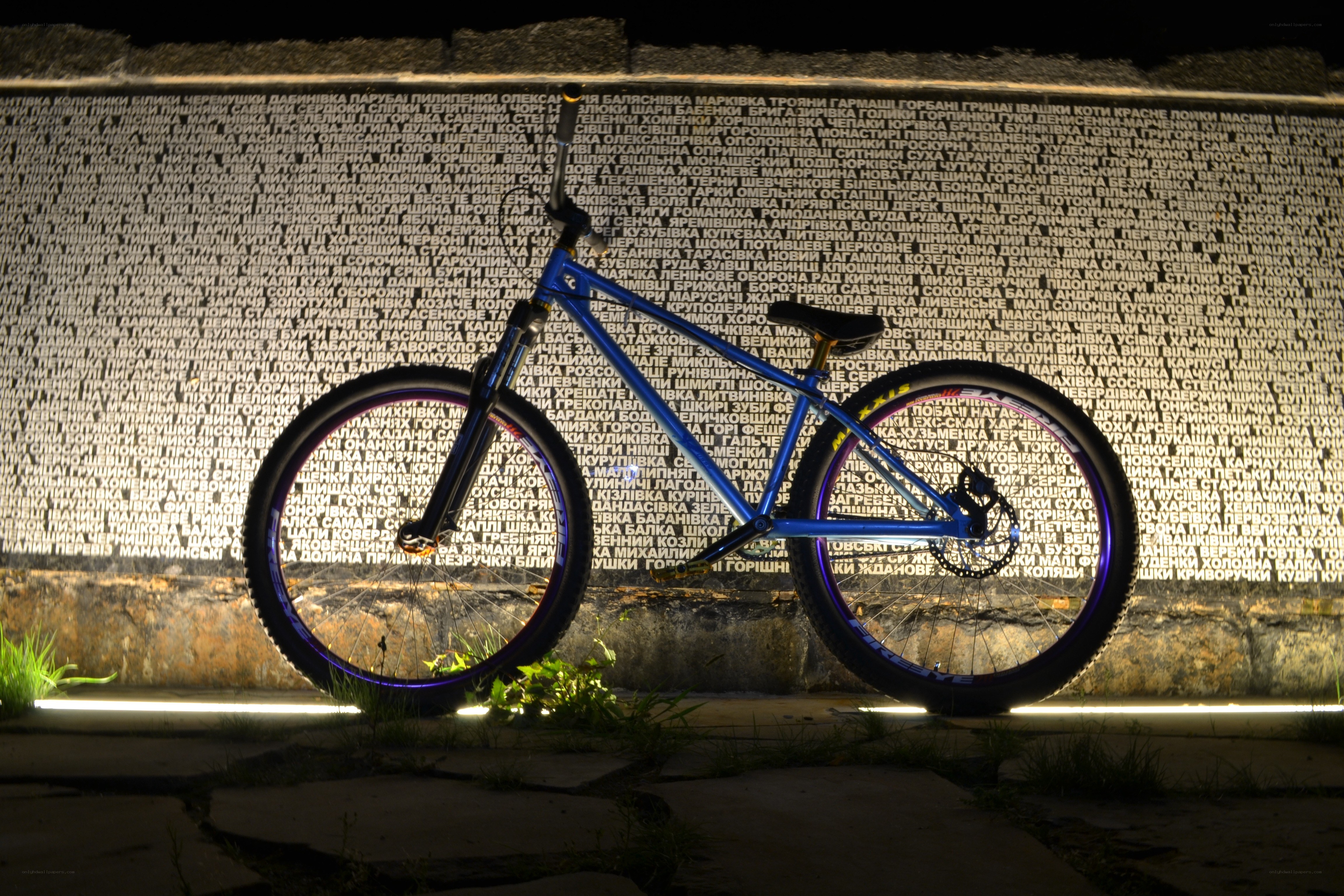Blue bicycle at night