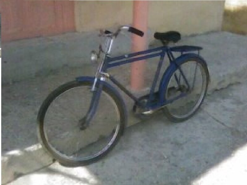 Blue Bicycle on Sidewalk