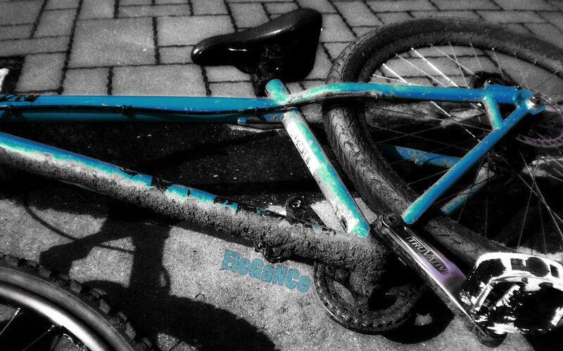 blue bike on pavement