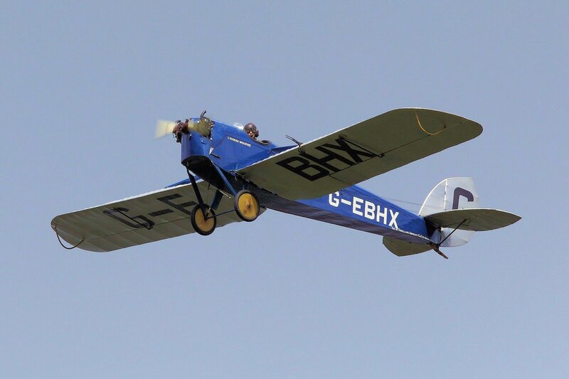 Blue Biplane in Flight — Calm