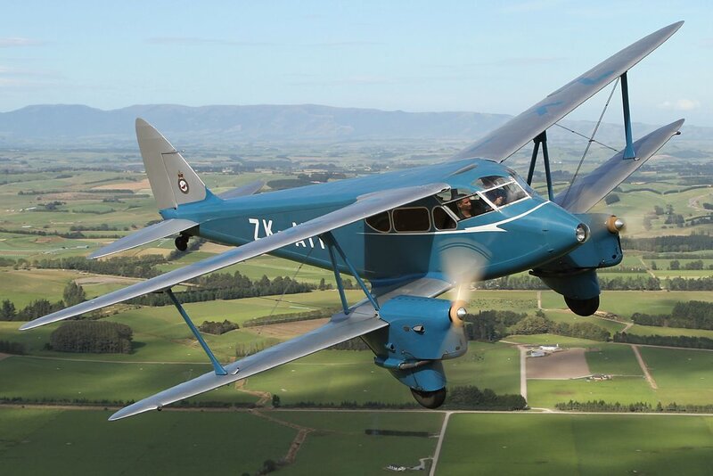 Blue Biplane in Flight — Serene