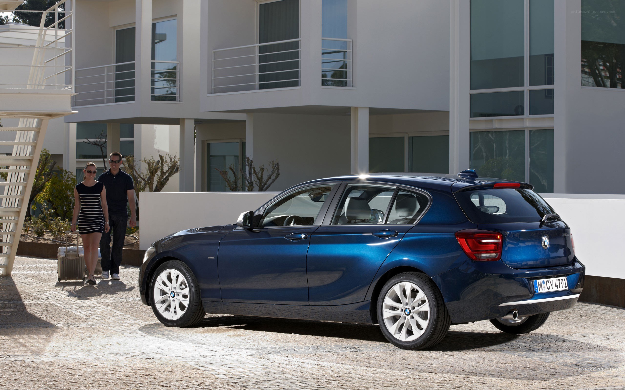 Blue BMW 1 Series parked outside