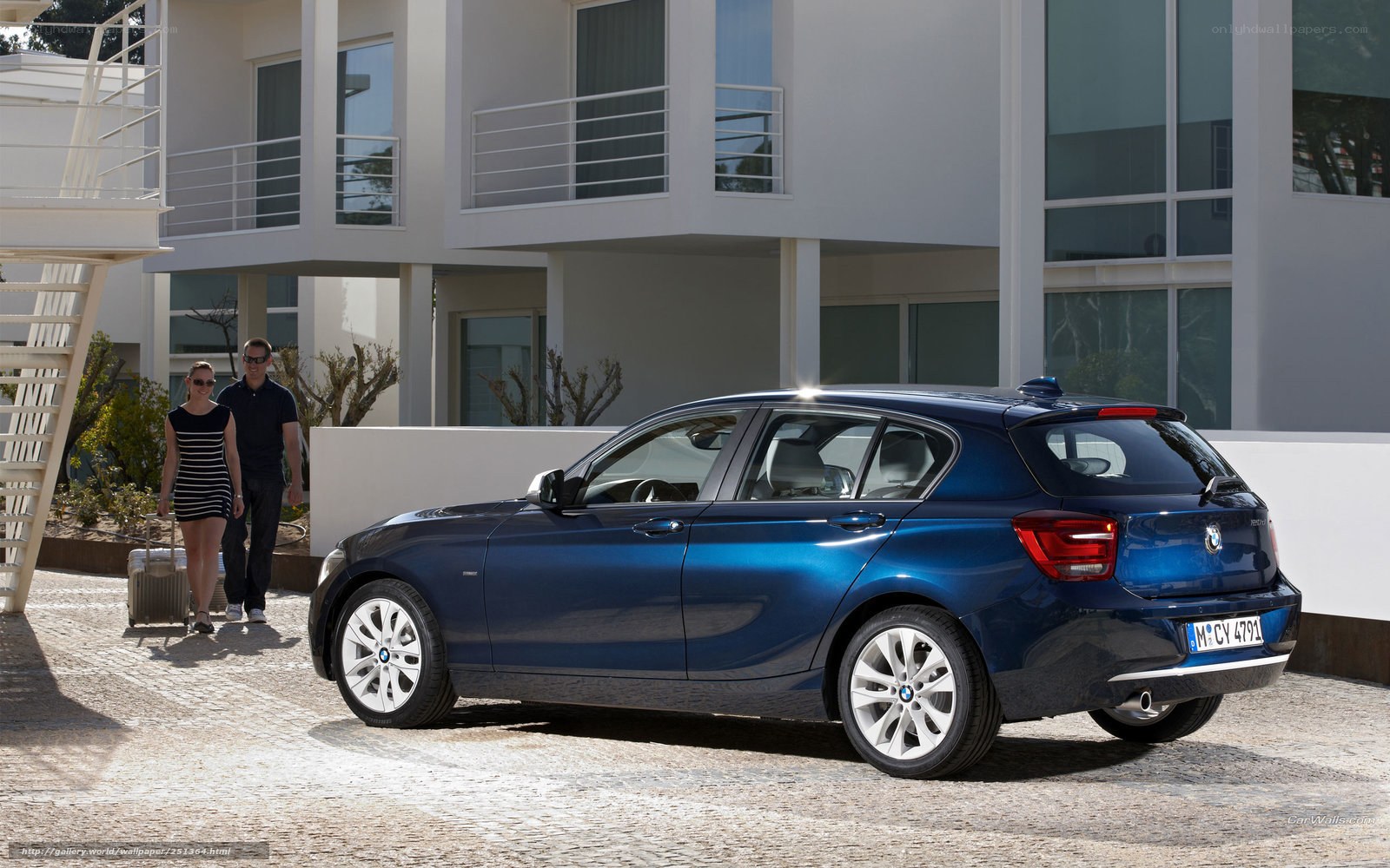 Blue BMW 1 Series parked outside