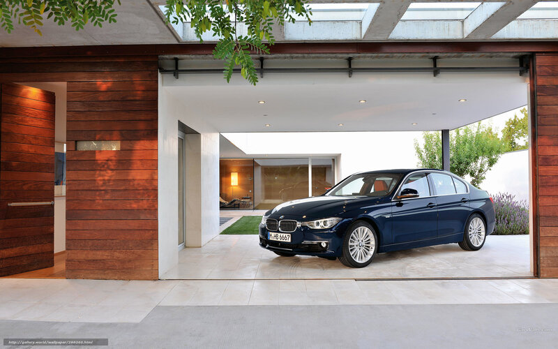 Blue BMW 3 Series in modern garage