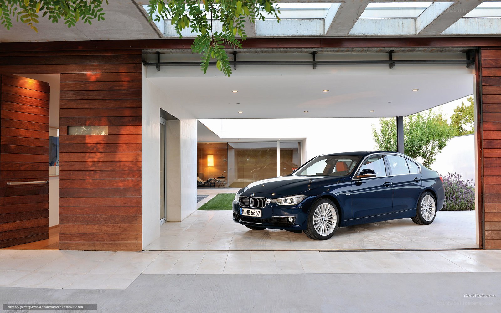 Blue BMW 3 Series in modern garage