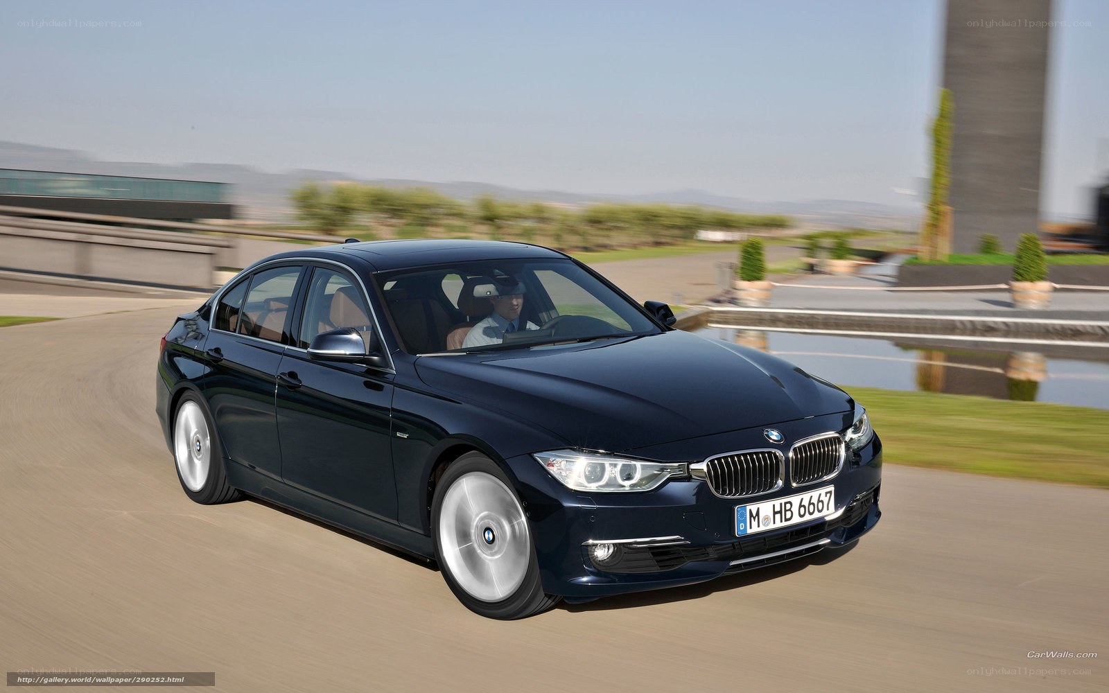 Blue BMW 3 Series in motion