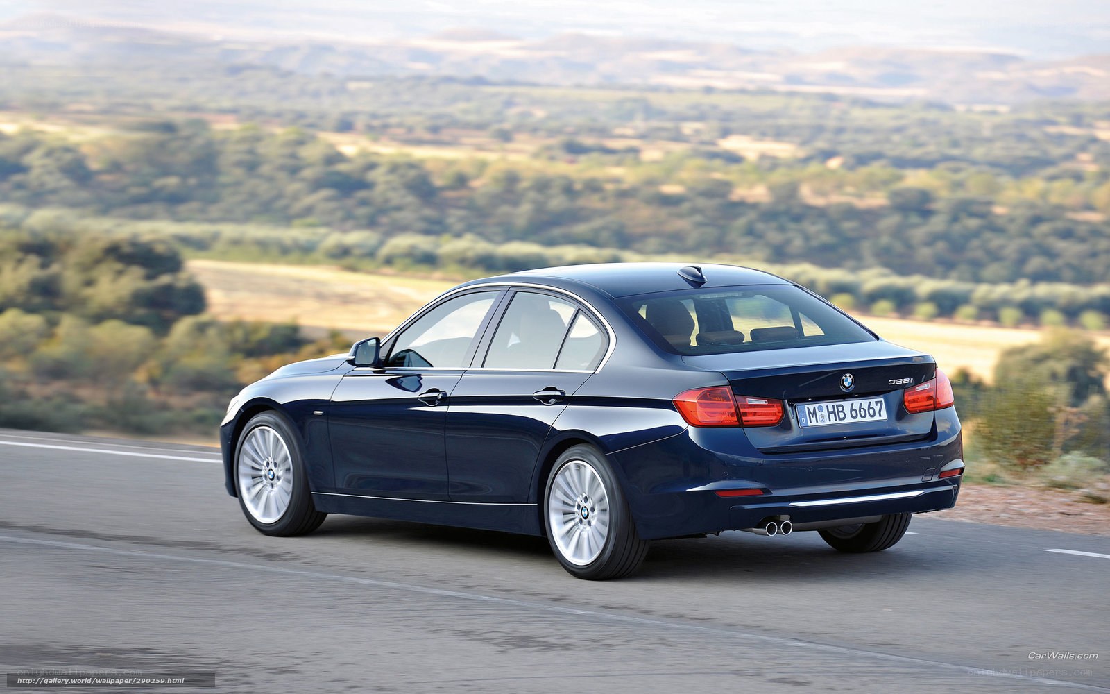 blue bmw 328i on scenic road