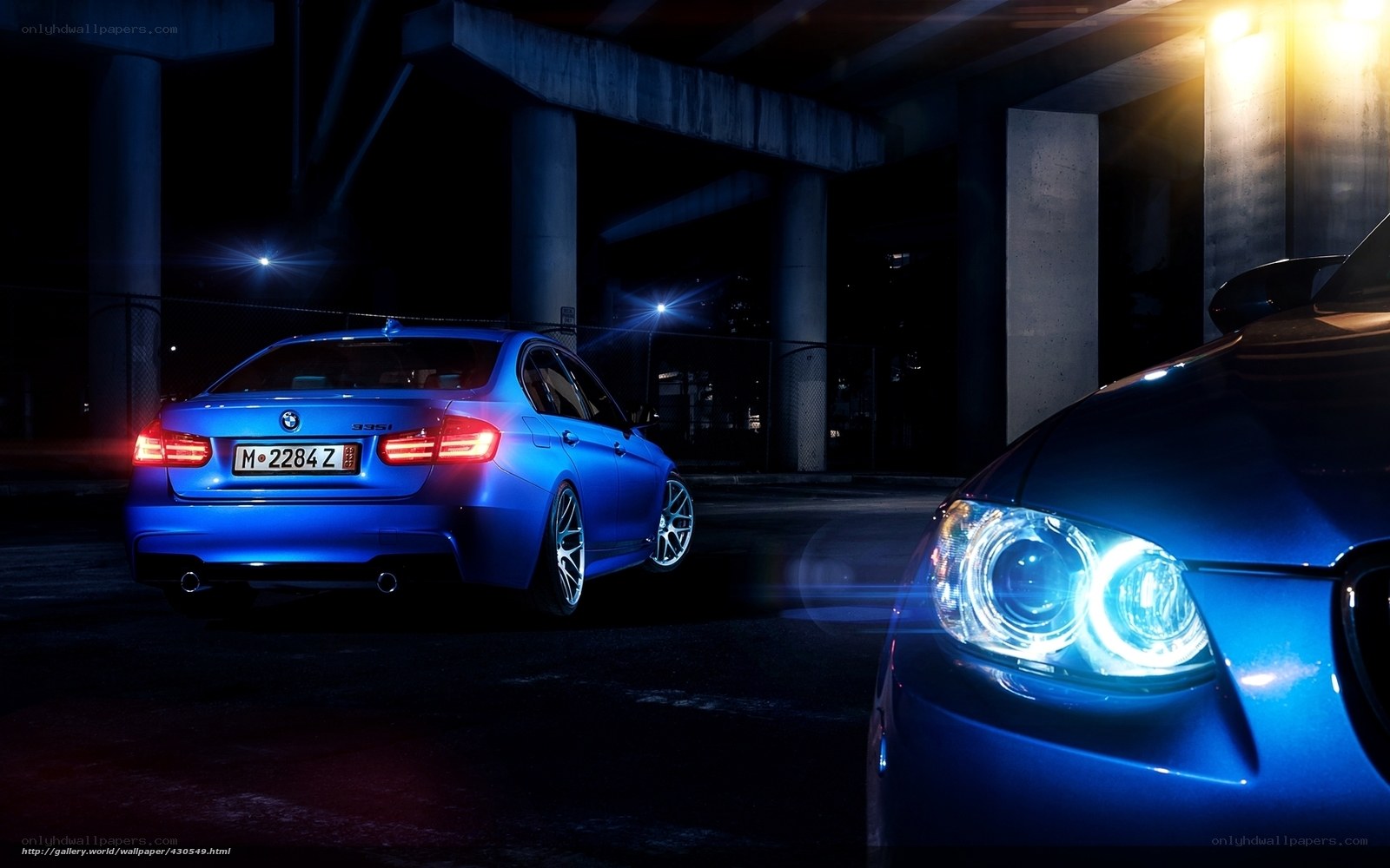 Blue BMW 335i at night