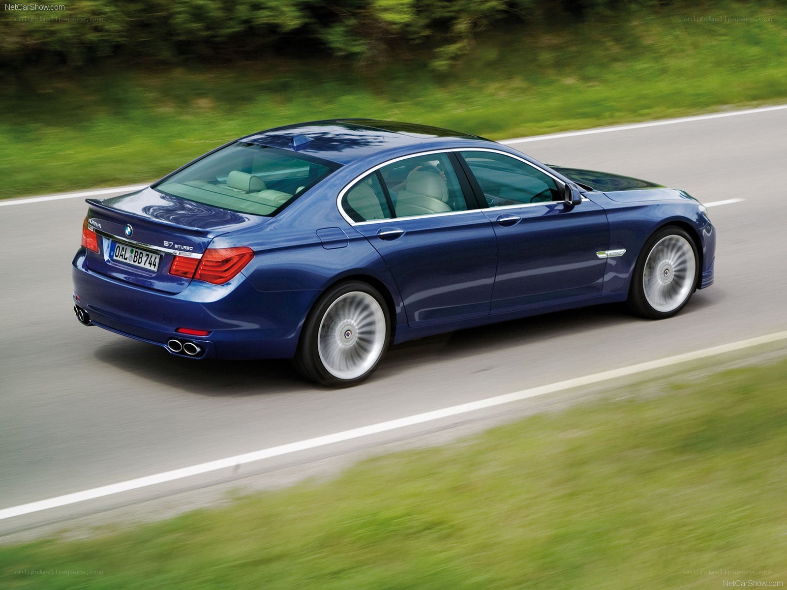 blue bmw 7 series driving