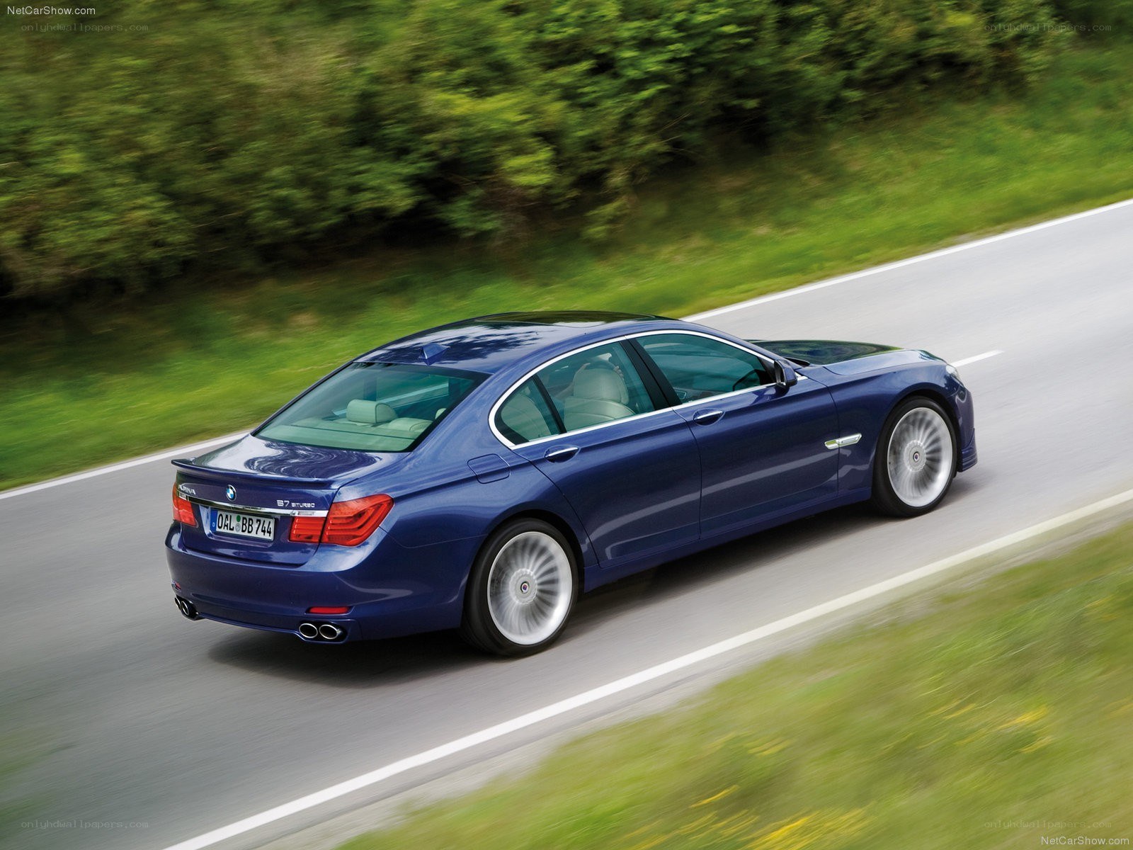 Blue BMW 7-Series in motion