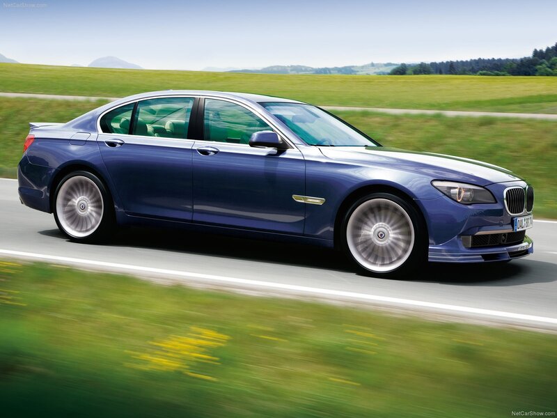 blue bmw alpina driving on road