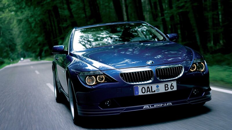 blue bmw alpina driving on road
