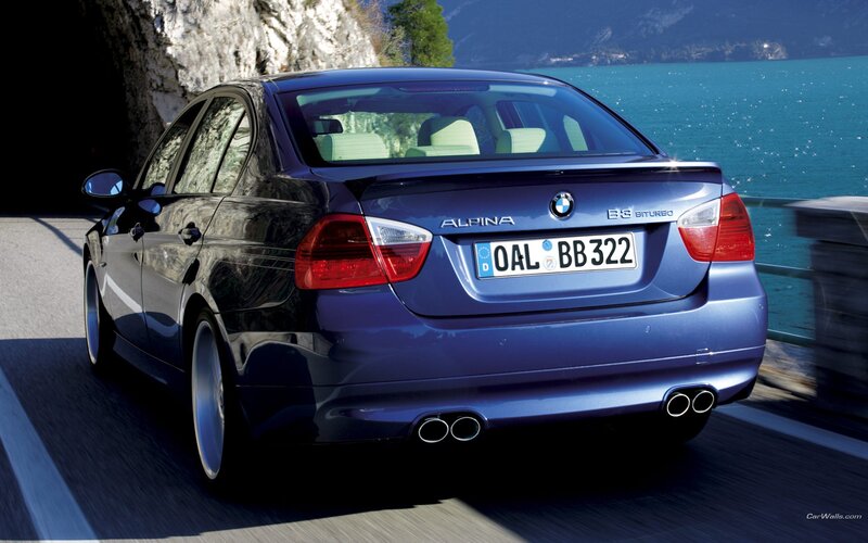 Blue BMW Alpina on coastal road