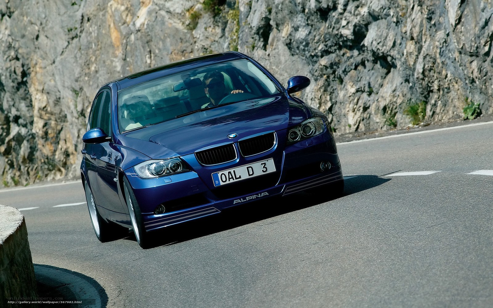 Blue BMW Alpina on mountain road