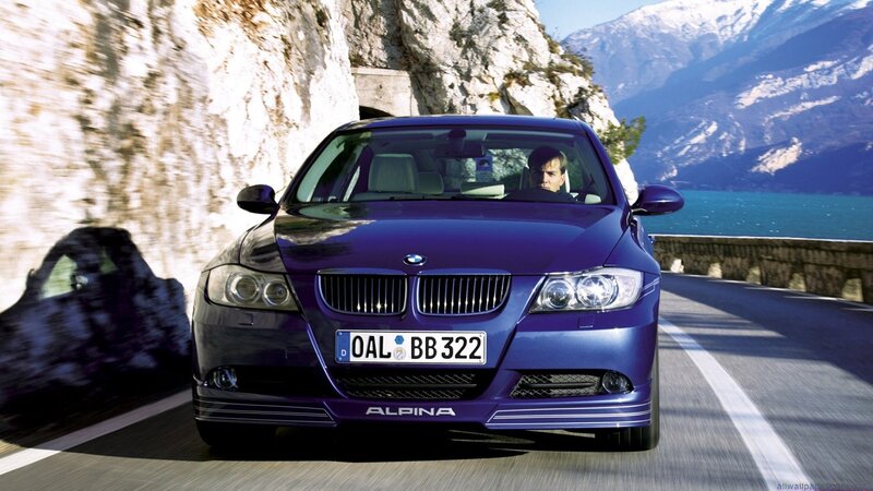 blue bmw alpina on mountain road