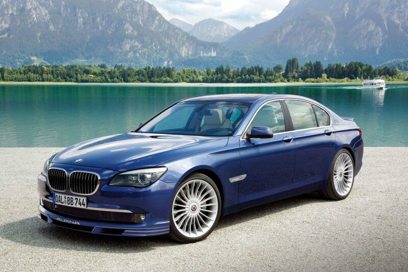 Blue BMW Alpina sedan by lake