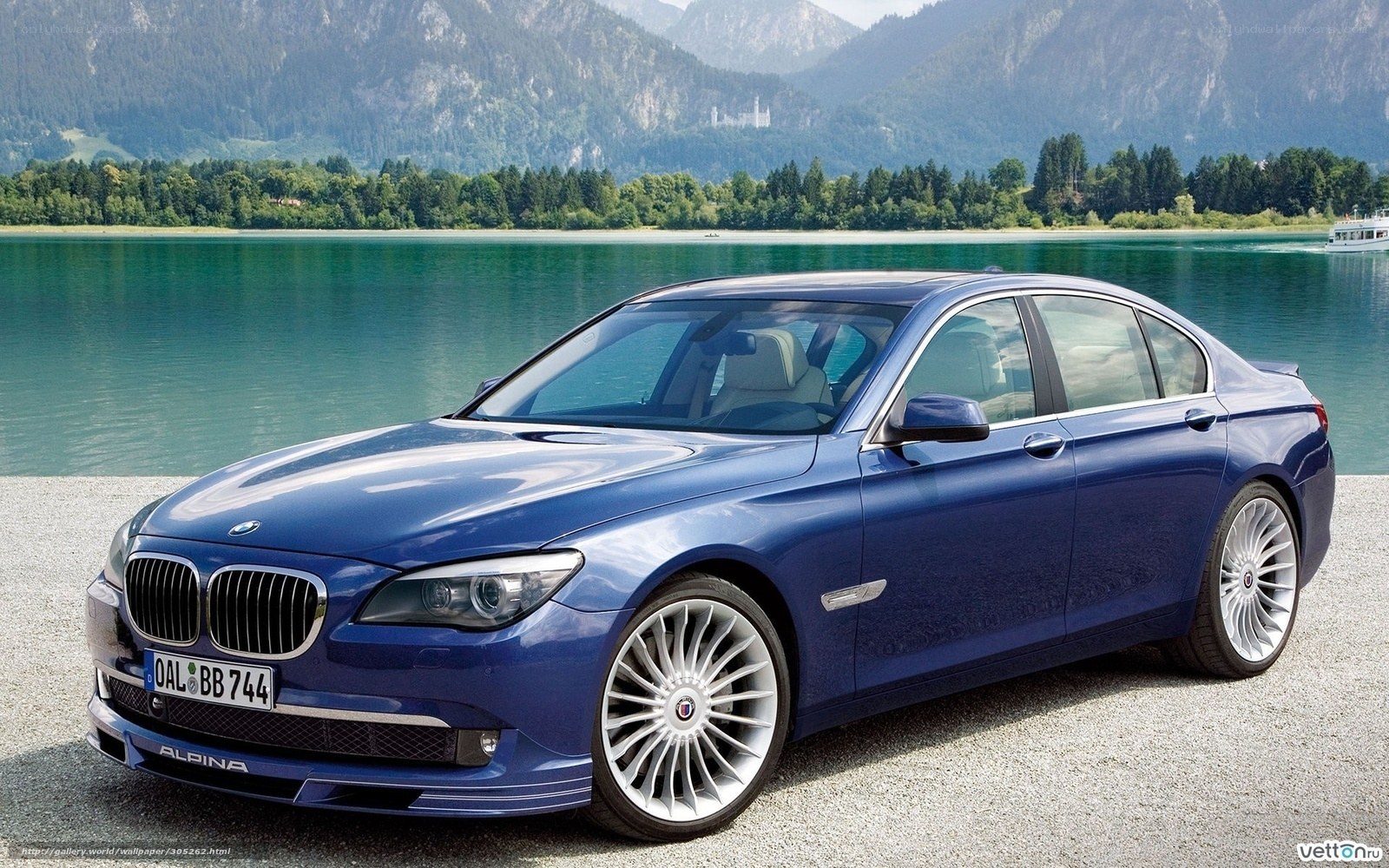 Blue BMW Alpina sedan by lake