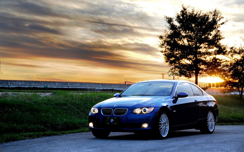 blue bmw at sunset