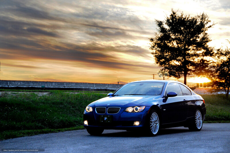Blue BMW at sunset