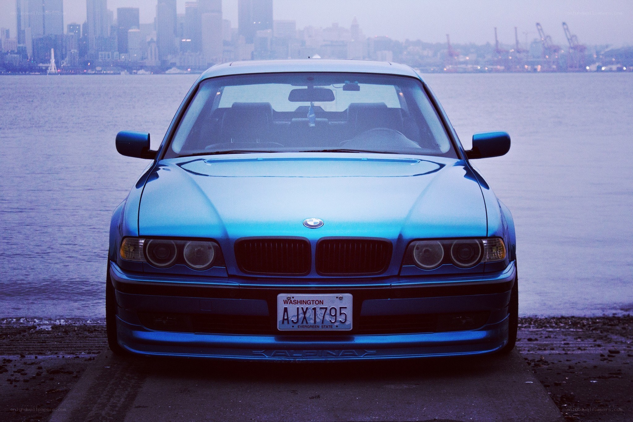 Blue BMW by the water