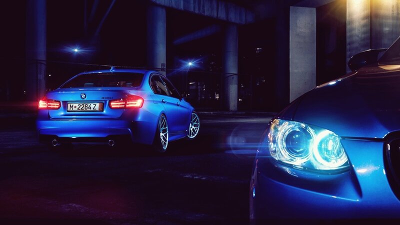 Blue BMW cars at night