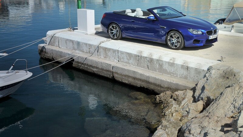 Blue BMW convertible at marina