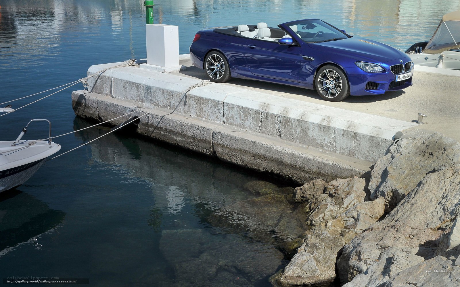 Blue BMW convertible at marina