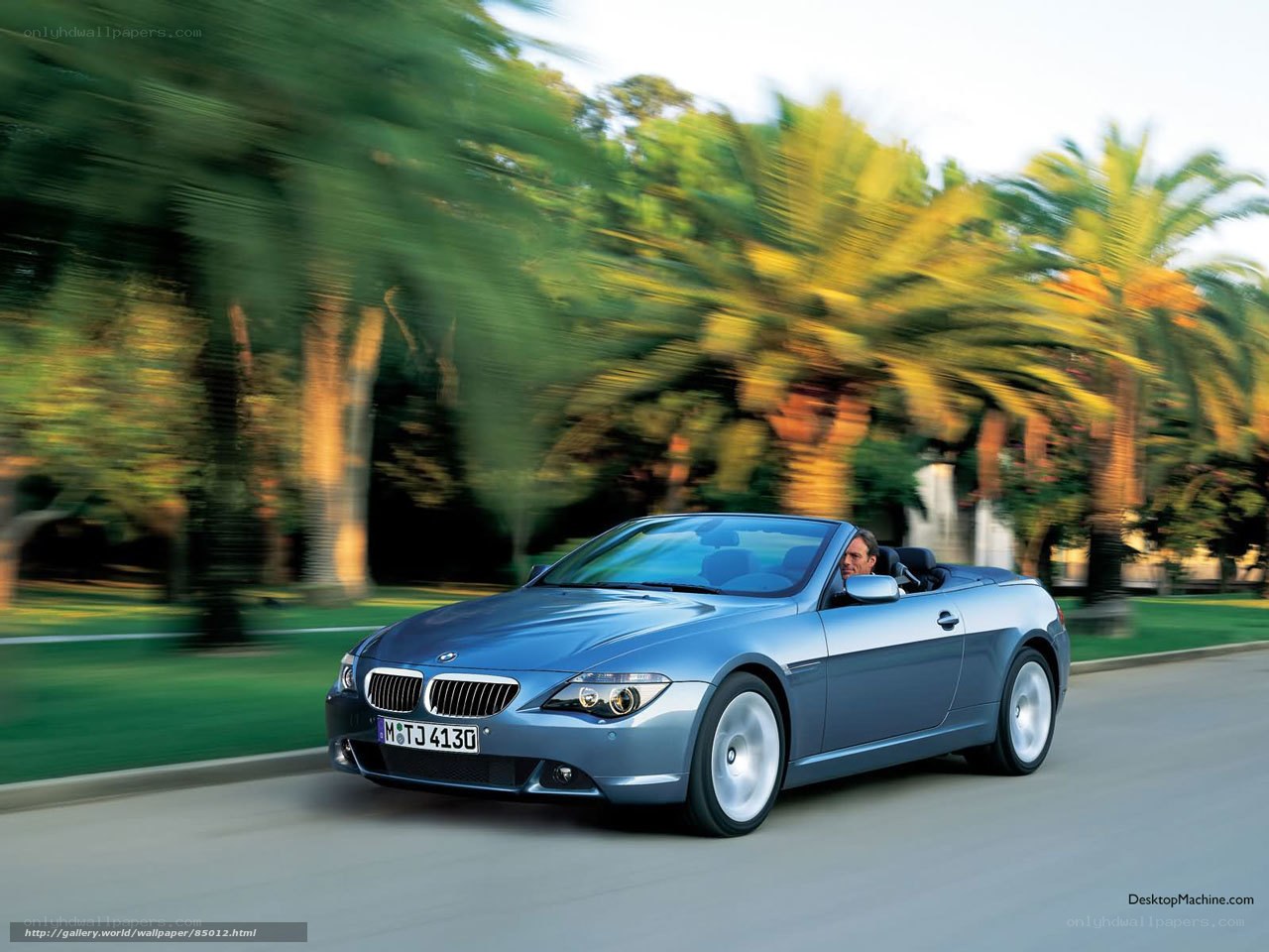 Blue BMW convertible in motion