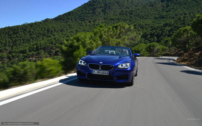 blue bmw convertible on mountain road