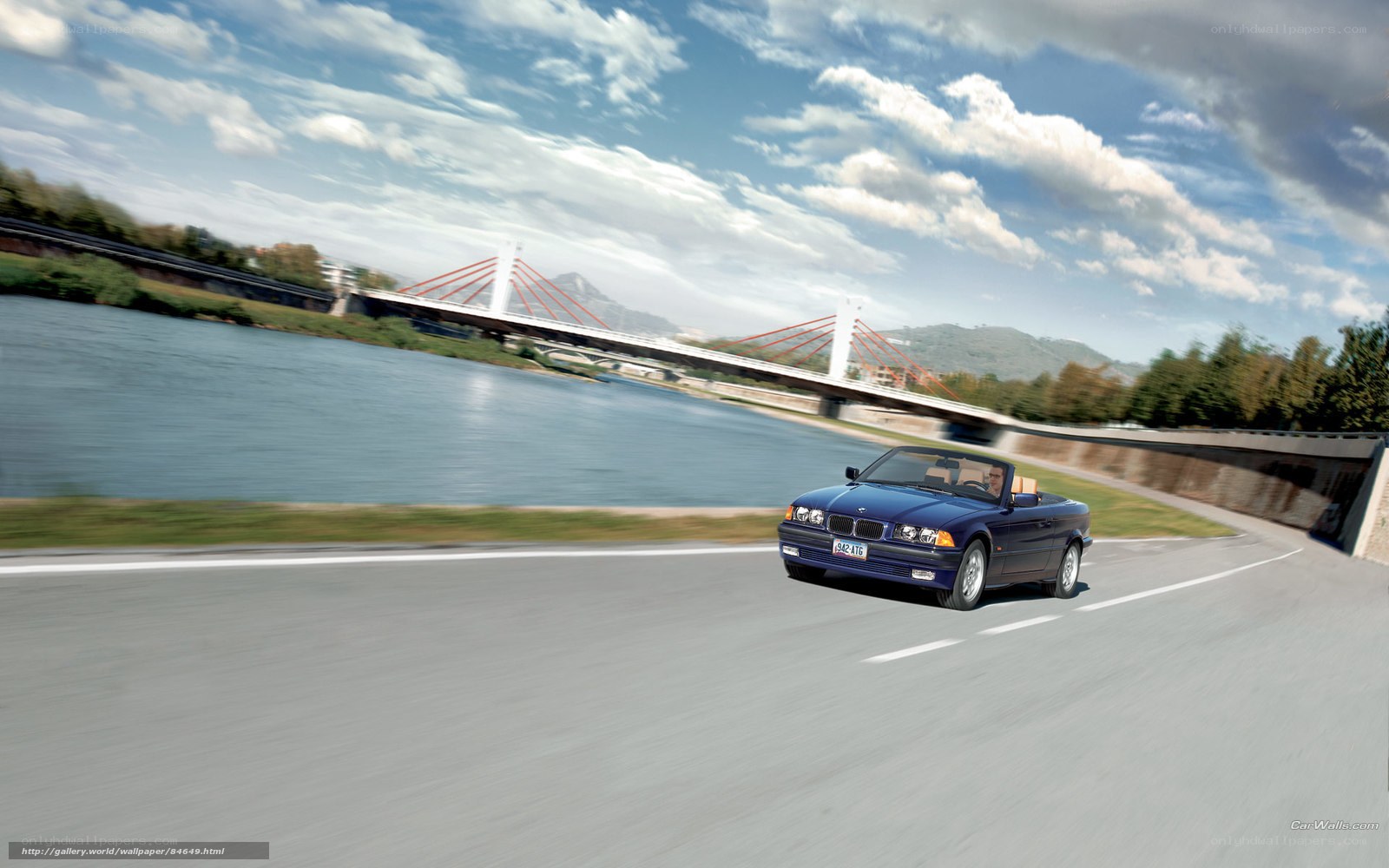 Blue BMW convertible on road