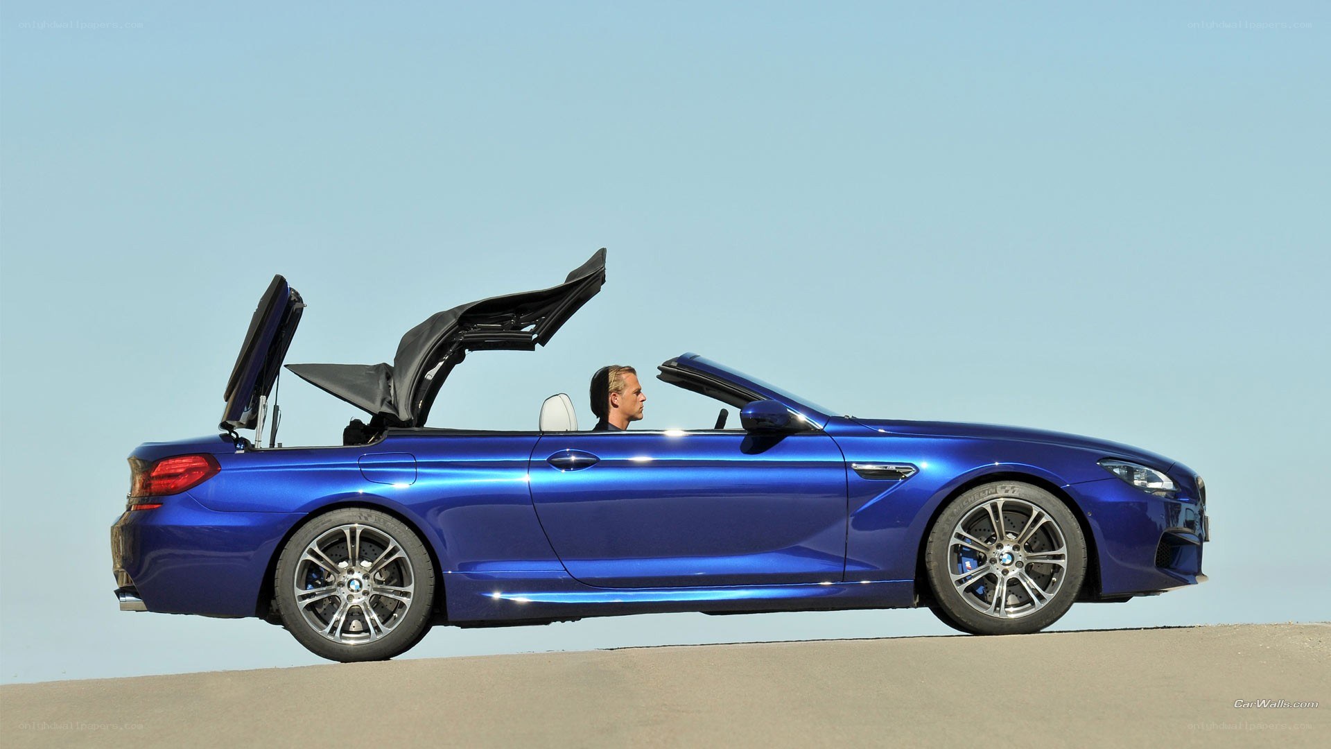 Blue BMW convertible with open top