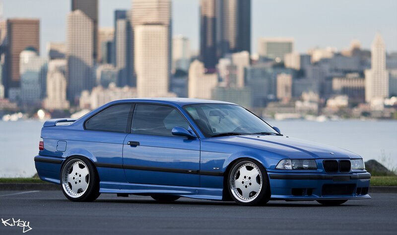 Blue BMW coupe in city