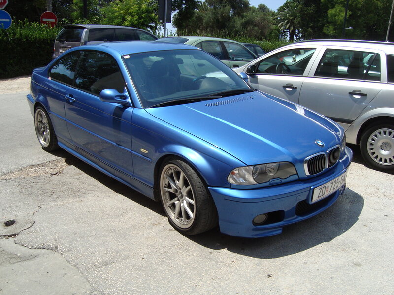 blue bmw coupe parked