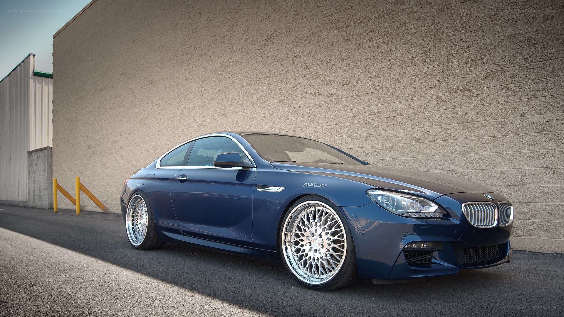 Blue BMW coupe parked