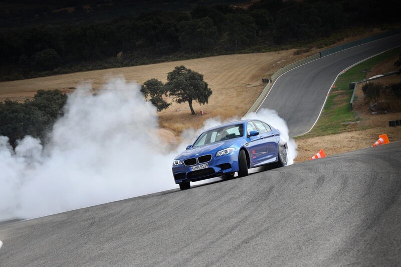 Blue BMW drifting on track